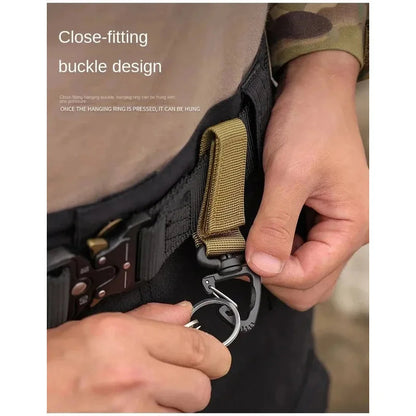 Tailwag Factory khaki nylon MOLLE key hook clip attached to a tactical belt for easy gear access