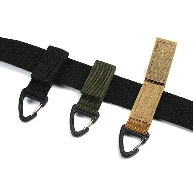 Tailwag Factory tactical MOLLE key hook clips in black, olive green, and khaki attached to a black webbing strap.
